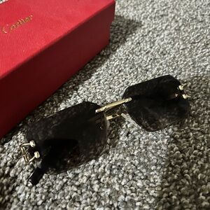 Cartier Black Rimless Sunglasses with Gold Accents